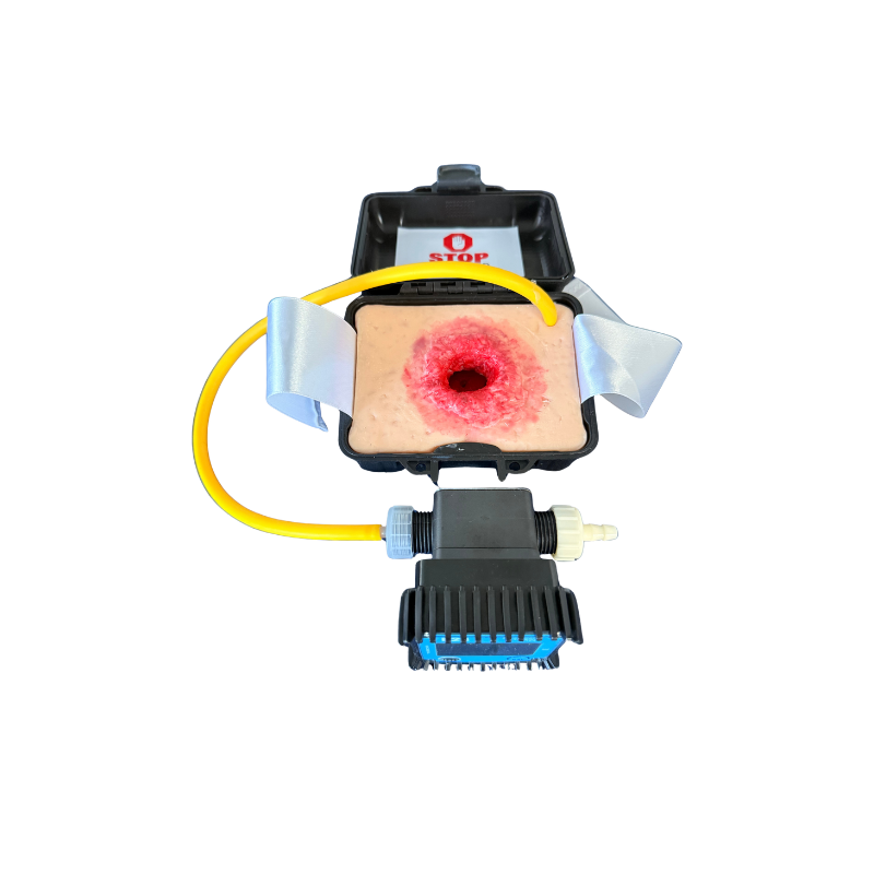 Wound packing simulator (gunshot wound) in transport case, with lost volume measuring pump